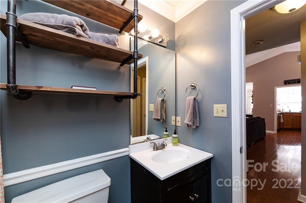 7760 Wallace Lane Denver, NC 28037 - Photo 38 of 48 a bathroom with a sink and a mirror