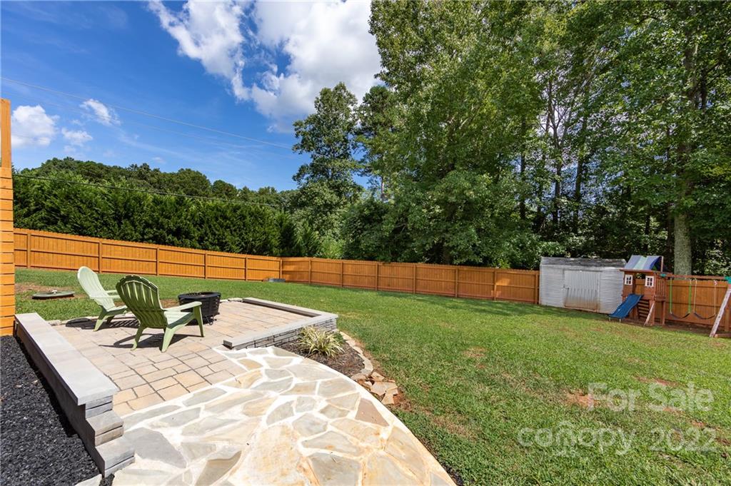 7760 Wallace Lane Denver, NC 28037 - Photo 48 of 48 a view of a backyard with a patio