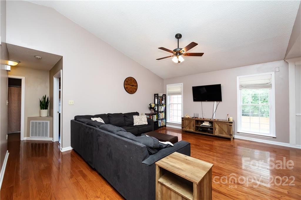 7760 Wallace Lane Denver, NC 28037 - Photo 6 of 48 a living room with furniture and a flat screen tv