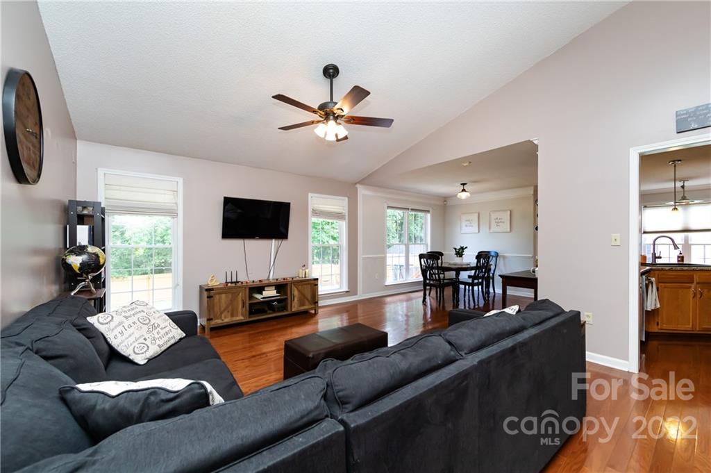 7760 Wallace Lane Denver, NC 28037 - Photo 7 of 48 a living room with furniture and a flat screen tv