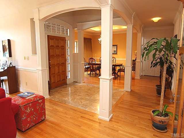 4000 John S Raboteau Wynd Raleigh, NC 27612 - Photo 4 of 12 a living room with furniture and a potted plant