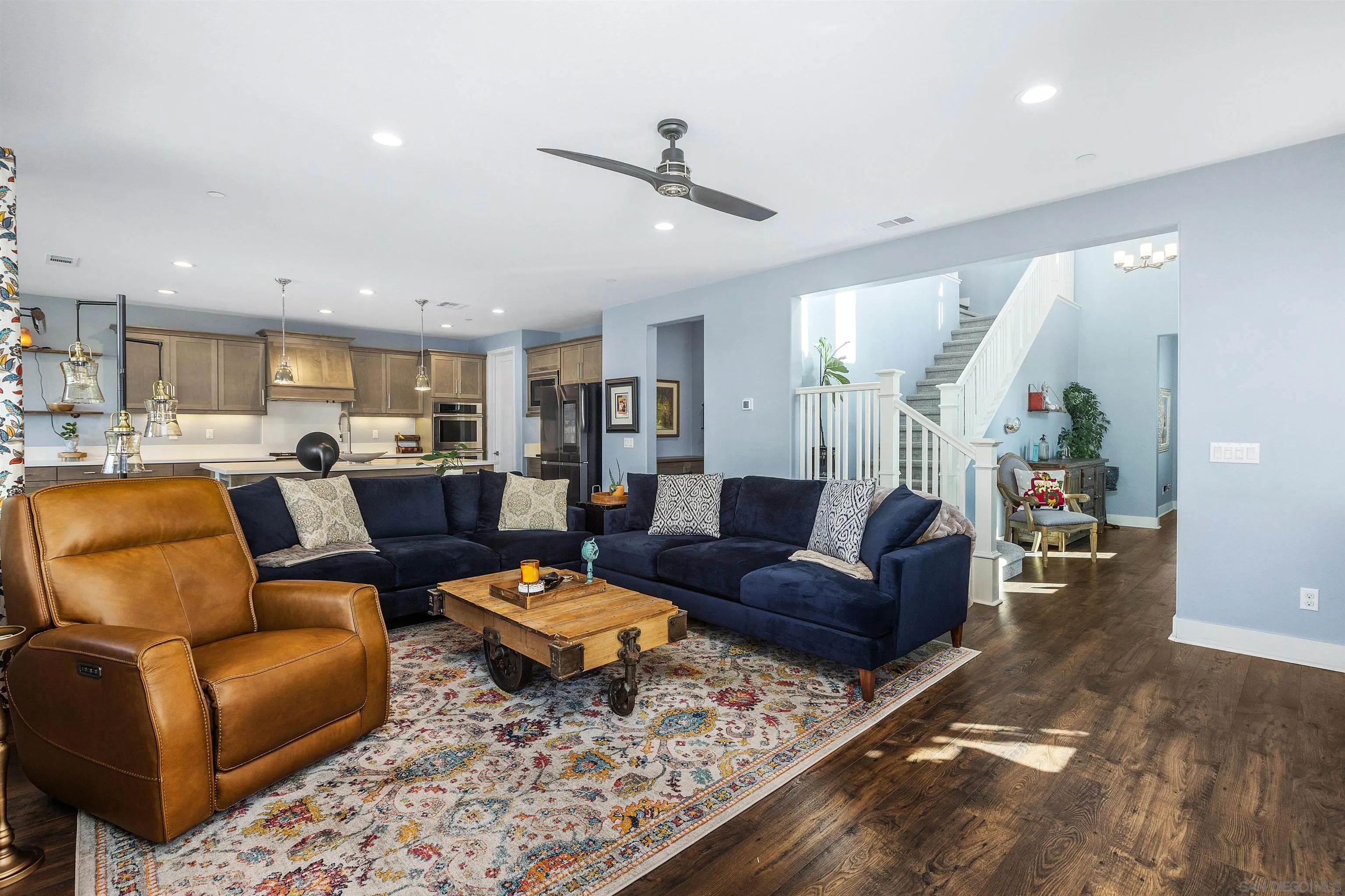 238 Ventasso Way Fallbrook, CA 92028 - Photo 11 of 52 a living room with furniture wooden floor and a view of kitchen
