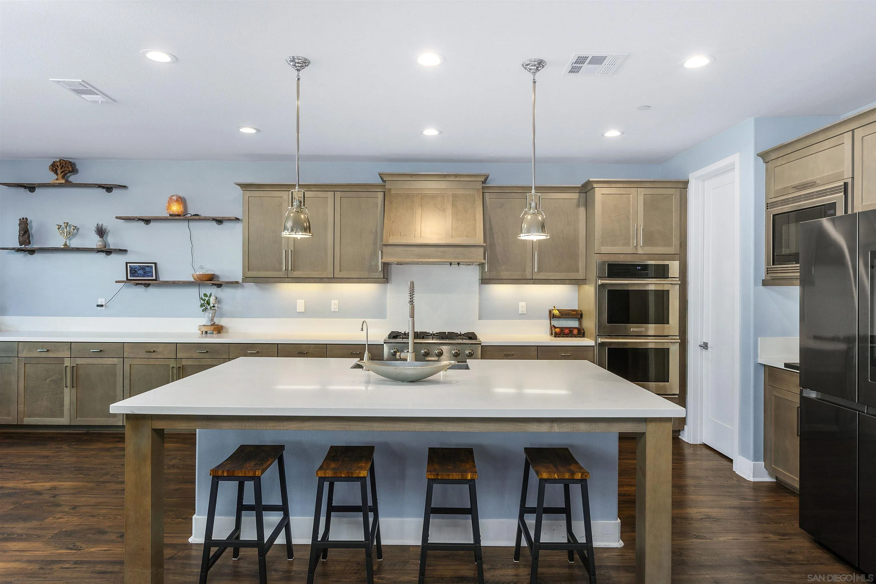 238 Ventasso Way Fallbrook, CA 92028 - Photo 13 of 52 a kitchen with granite countertop a table chairs stainless steel appliances and cabinets