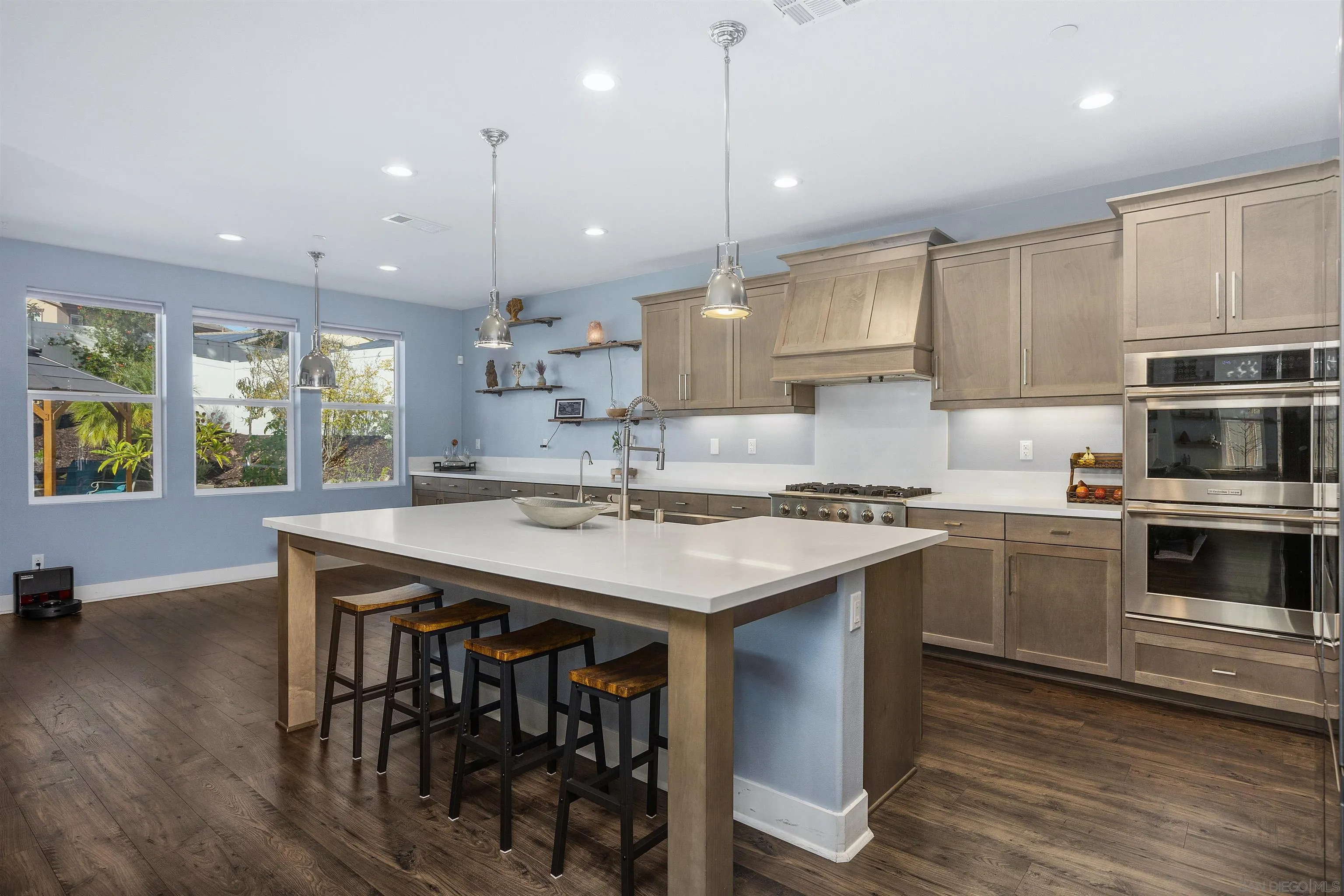 238 Ventasso Way Fallbrook, CA 92028 - Photo 14 of 52 a kitchen with a stove a sink a microwave a center island and cabinets