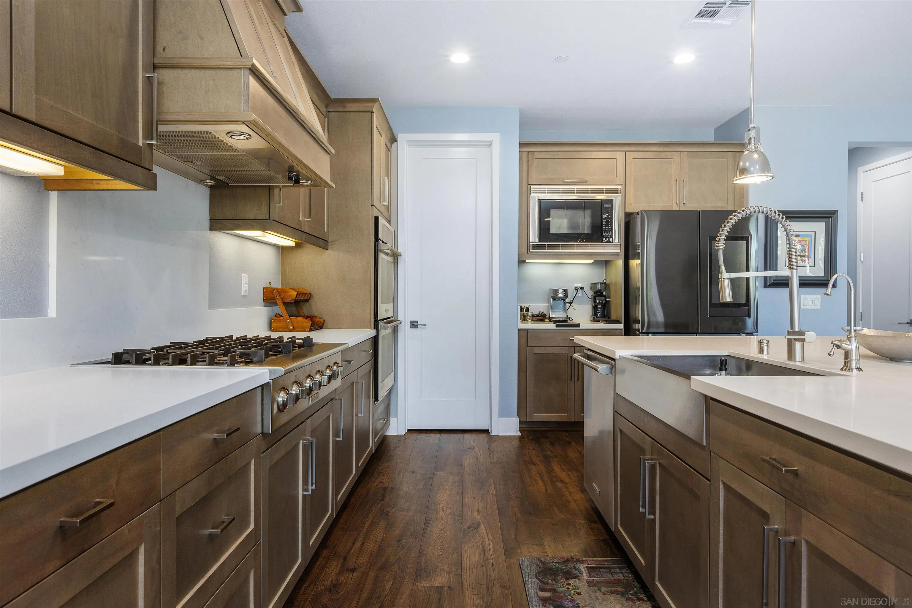 238 Ventasso Way Fallbrook, CA 92028 - Photo 16 of 52 a kitchen with stainless steel appliances granite countertop lots of counter top space and wooden floor
