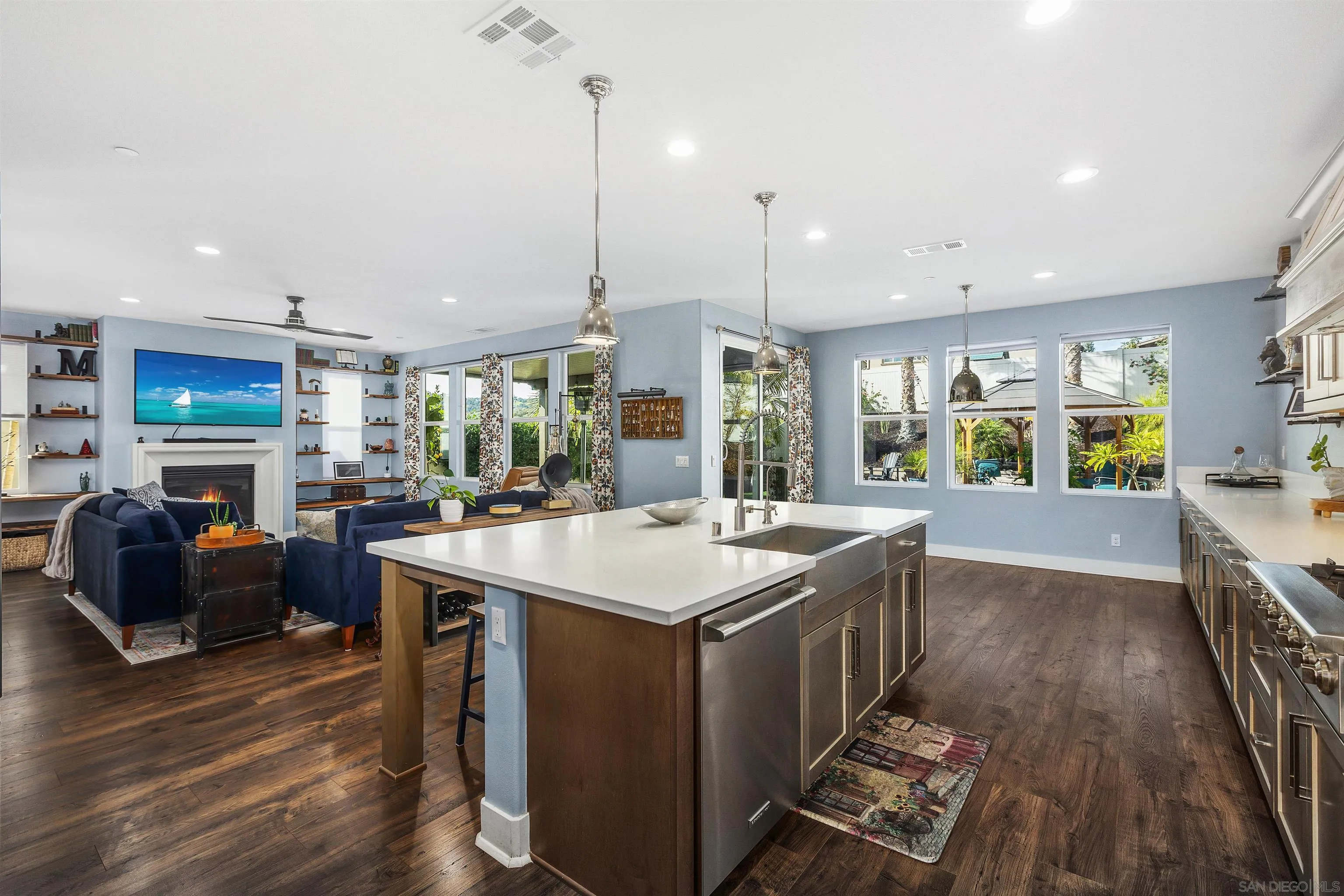 238 Ventasso Way Fallbrook, CA 92028 - Photo 17 of 52 a kitchen with stainless steel appliances granite countertop a stove and a wooden floors