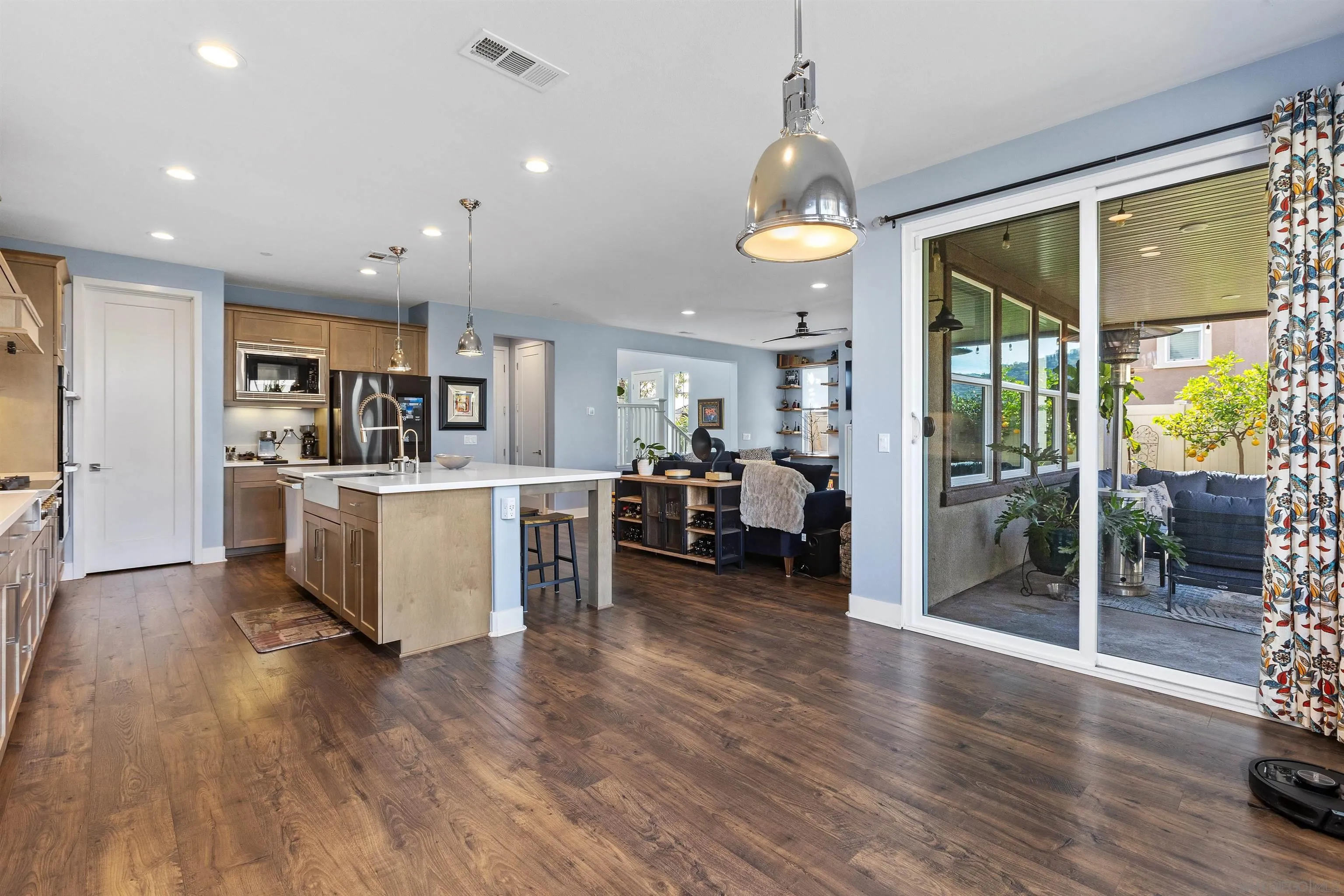 238 Ventasso Way Fallbrook, CA 92028 - Photo 19 of 52 a view of a kitchen with furniture and wooden floor