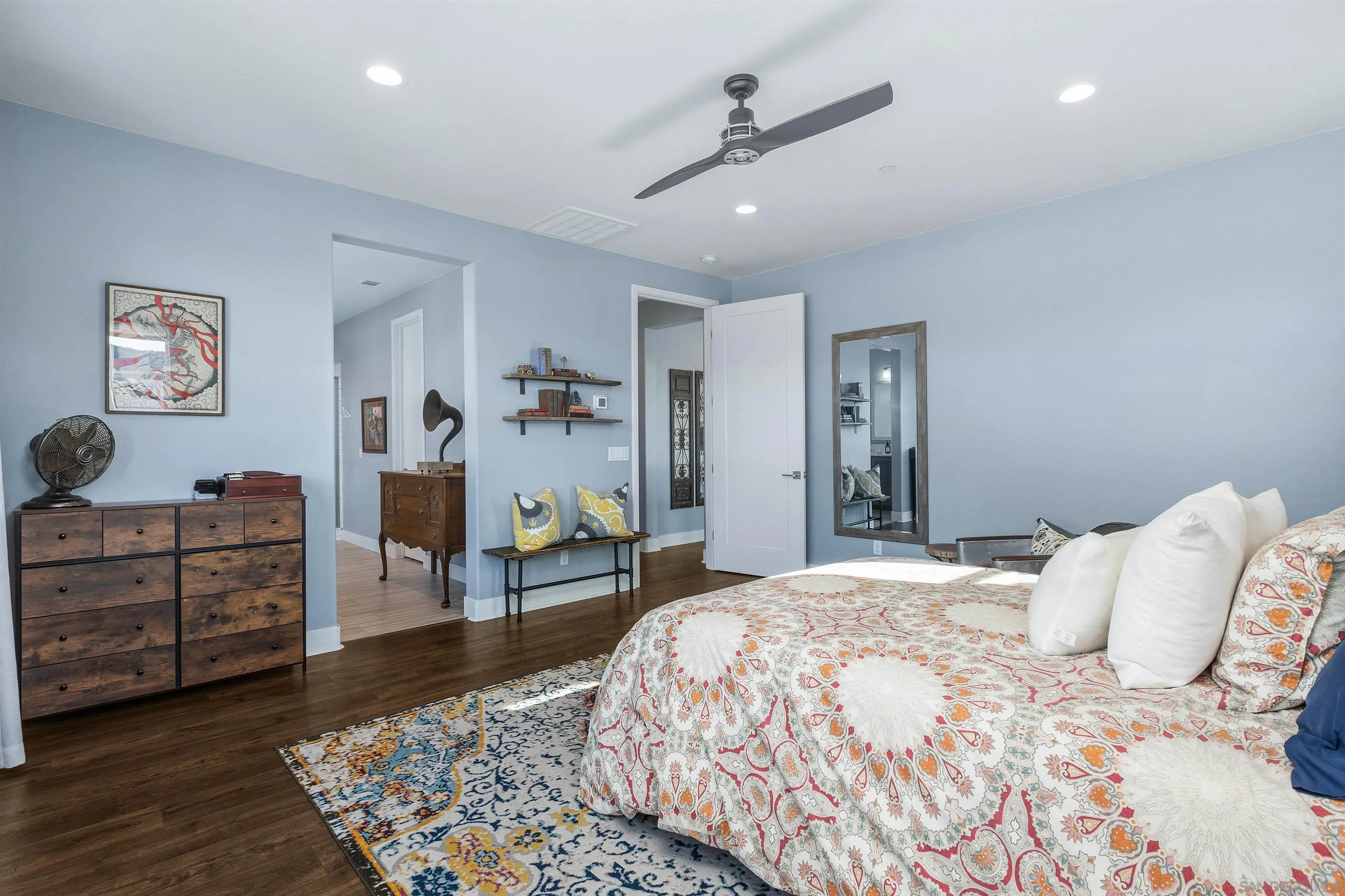 238 Ventasso Way Fallbrook, CA 92028 - Photo 26 of 52 a bedroom with a bed and a chandelier