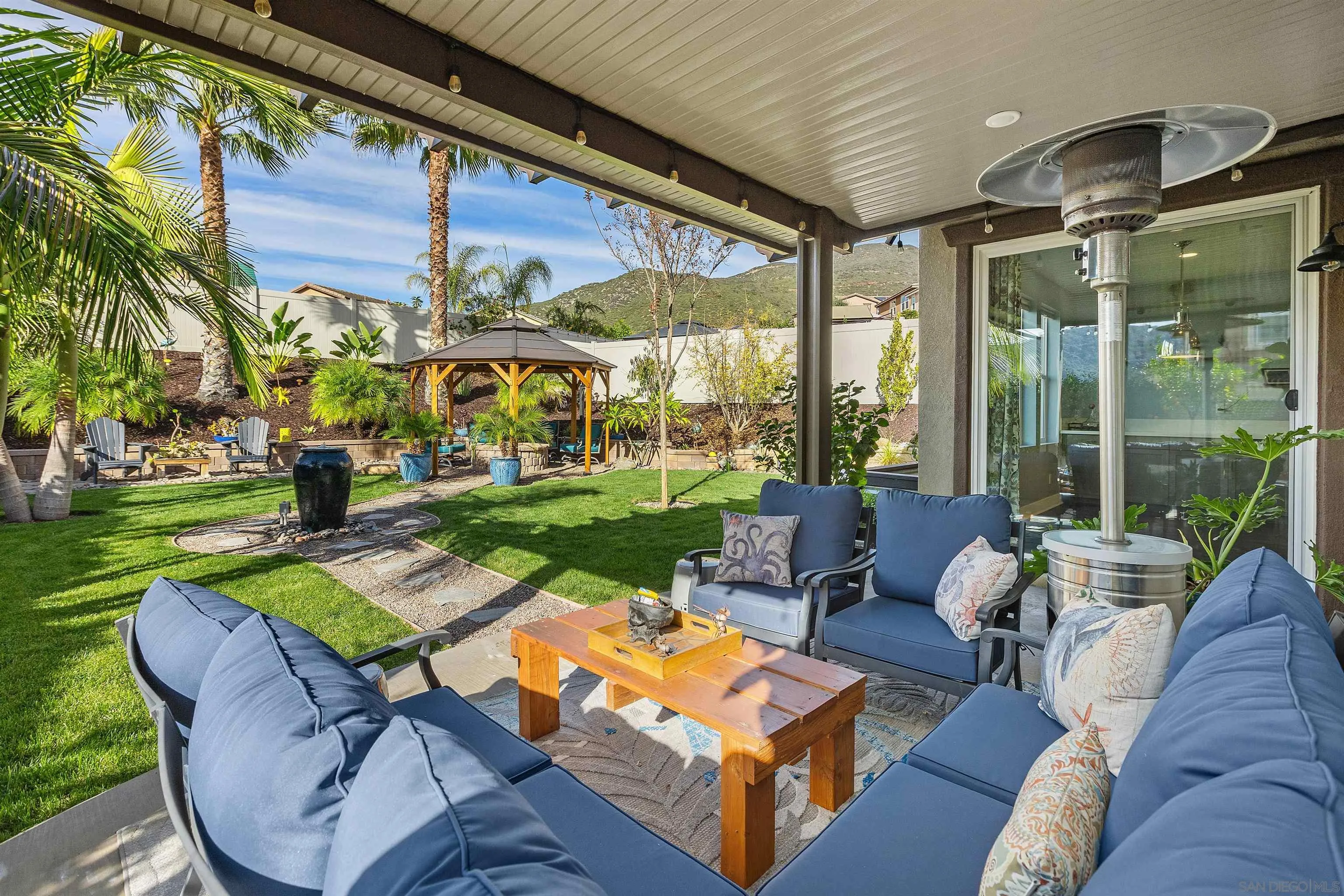 238 Ventasso Way Fallbrook, CA 92028 - Photo 30 of 52 a view of a patio with couches table and chairs
