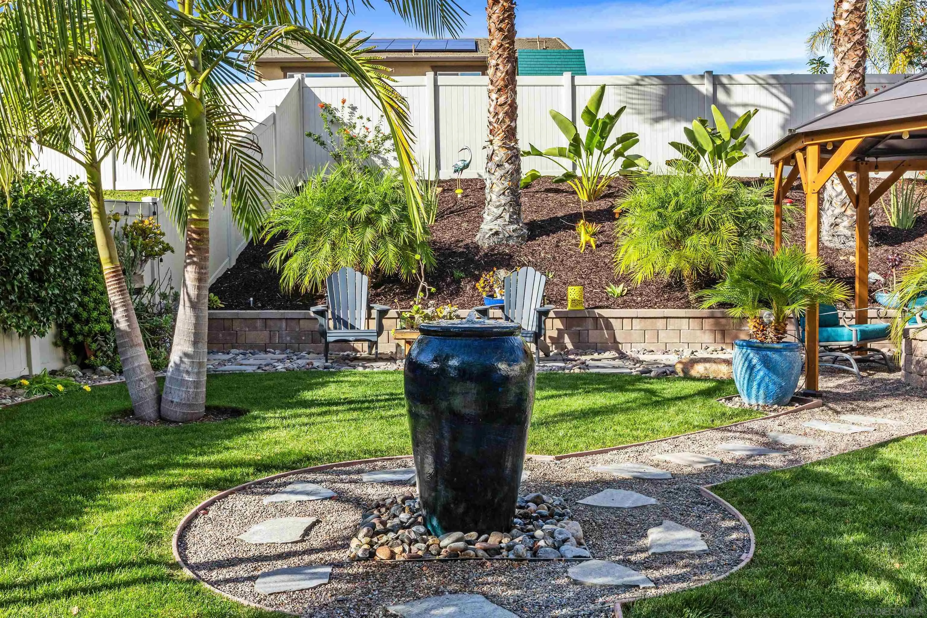 238 Ventasso Way Fallbrook, CA 92028 - Photo 33 of 52 a view of a garden with a fountain and a fountain