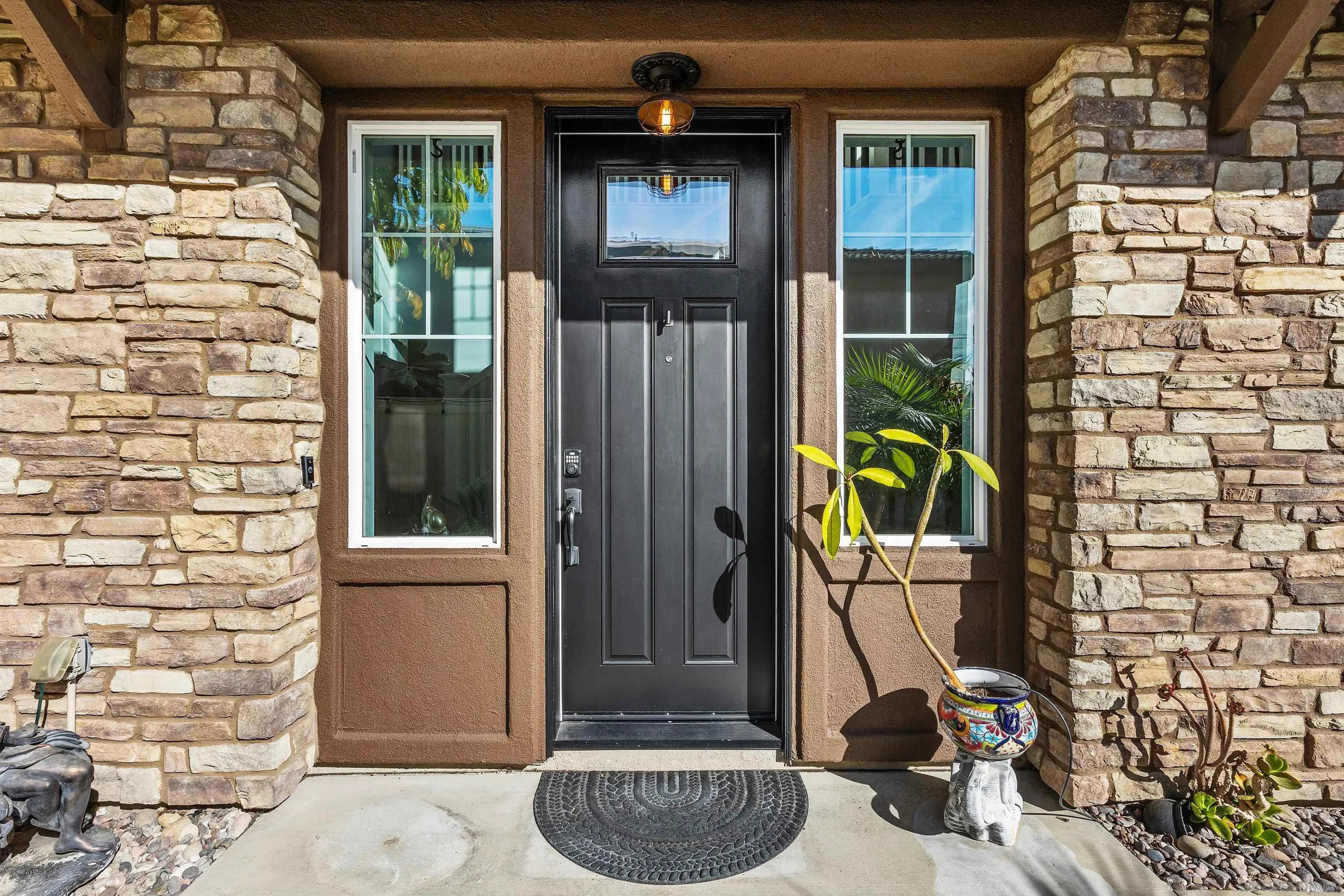 238 Ventasso Way Fallbrook, CA 92028 - Photo 5 of 52 a view of potted plant in front of a door