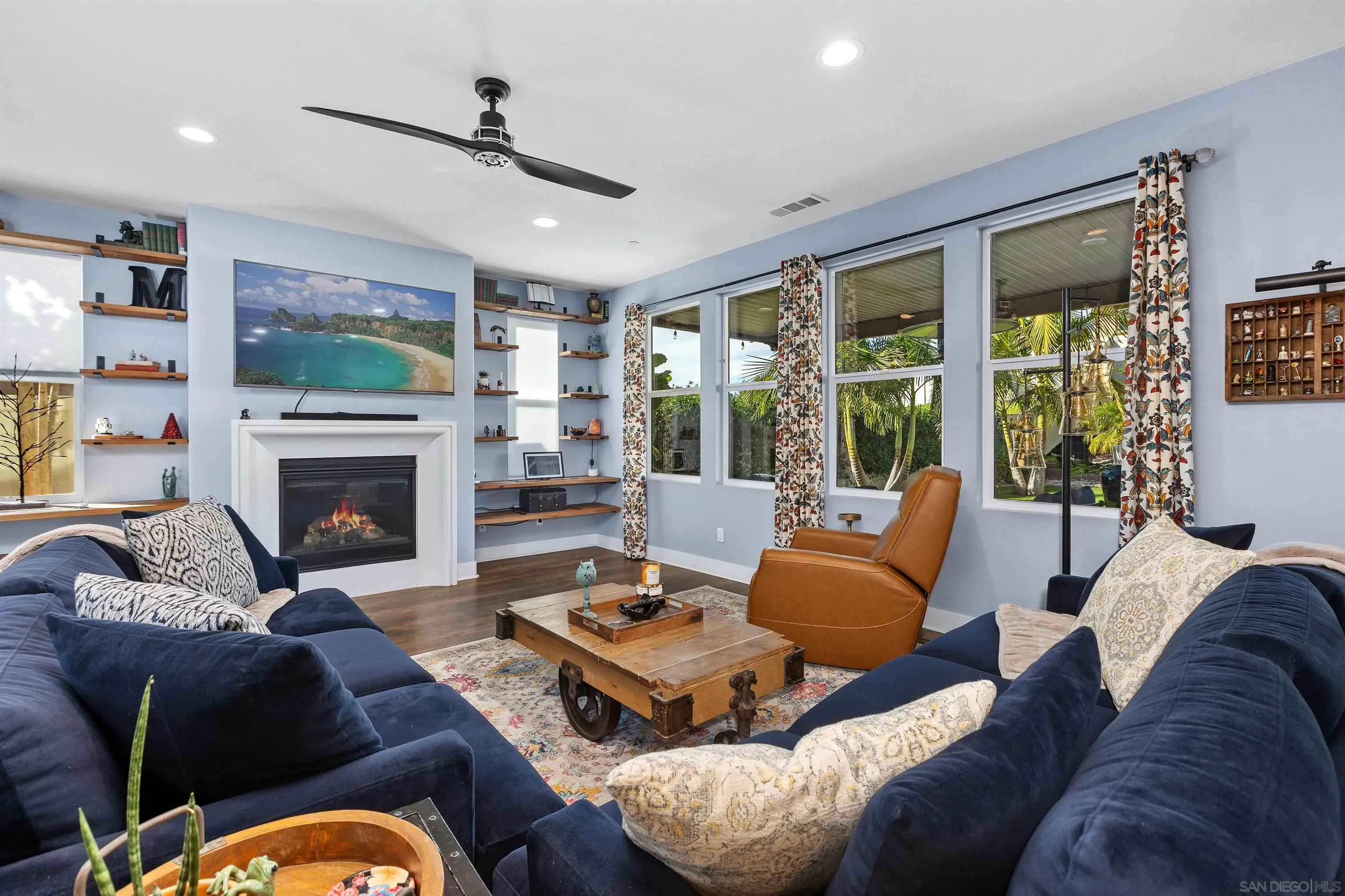238 Ventasso Way Fallbrook, CA 92028 - Photo 9 of 52 a living room with furniture a large window and a fireplace