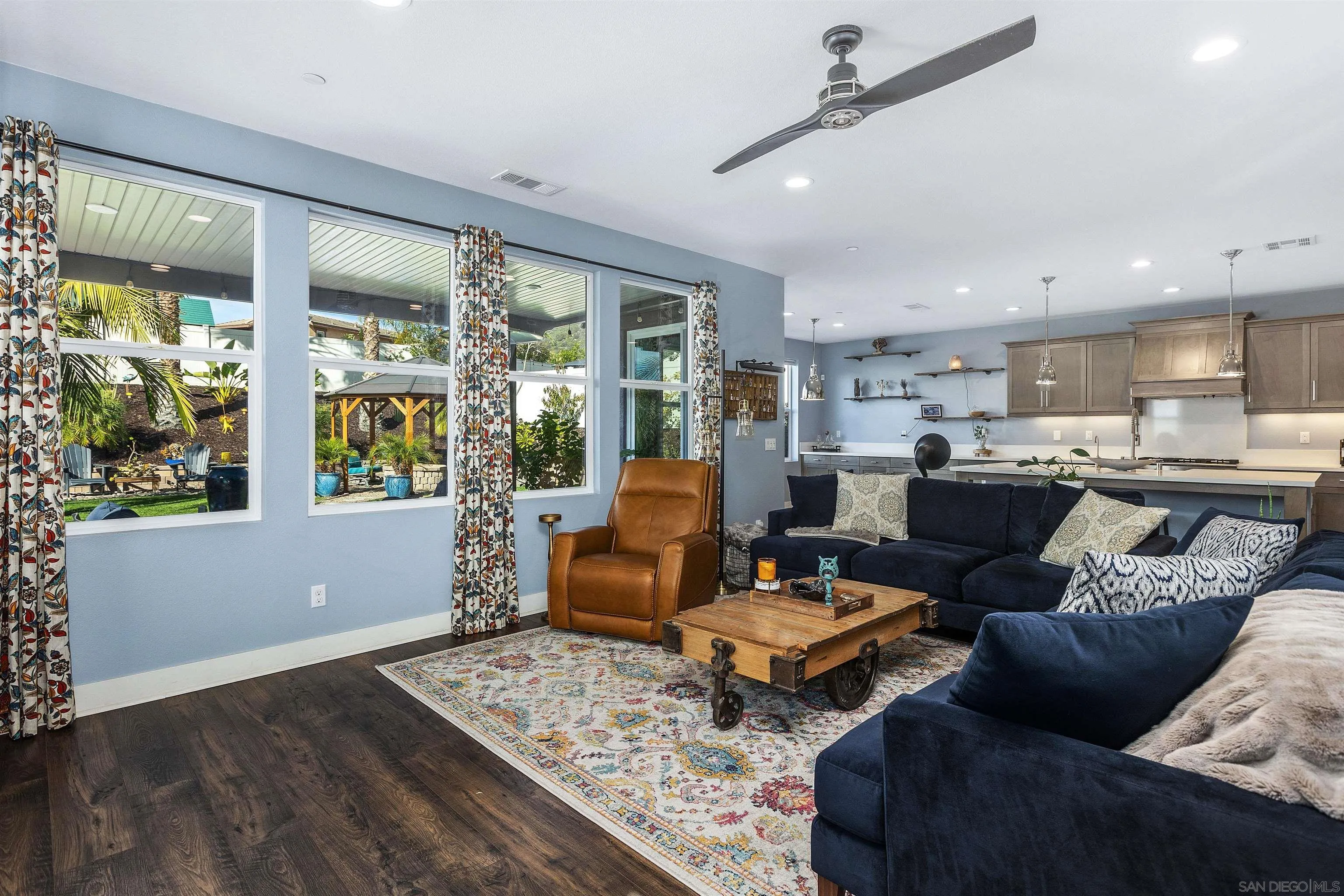 238 Ventasso Way Fallbrook, CA 92028 - Photo 10 of 52 a living room with furniture and large windows