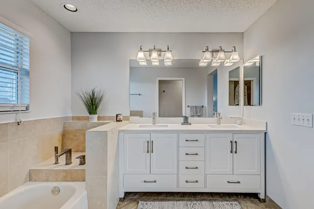 an aerial view of a house with a lake view