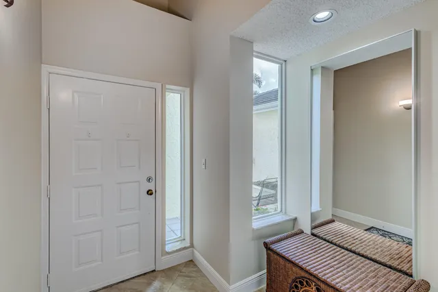 a view of a room with furniture and wooden floor