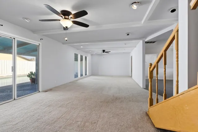 a view of a livingroom with a ceiling fan