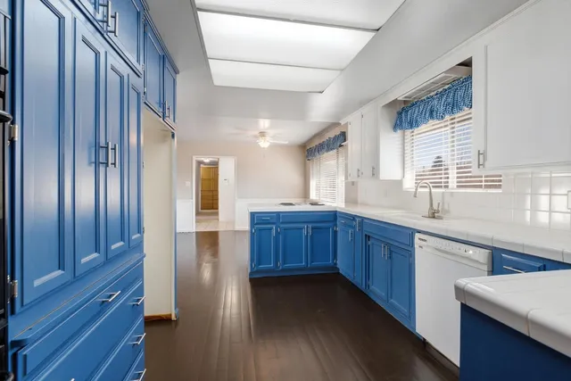 a view of storage and utility room with cabinets