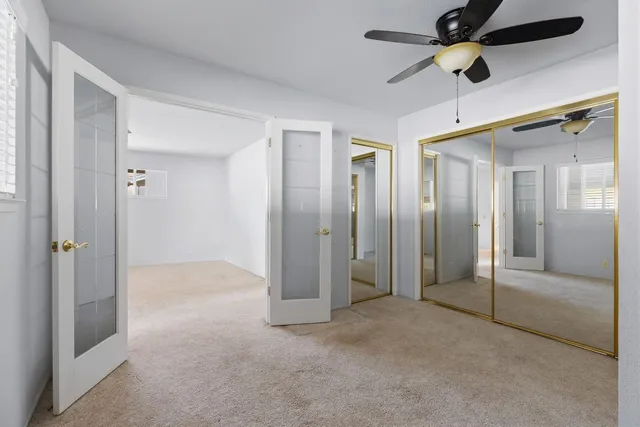 a spacious bathroom with a double vanity sink a mirror and a bathtub