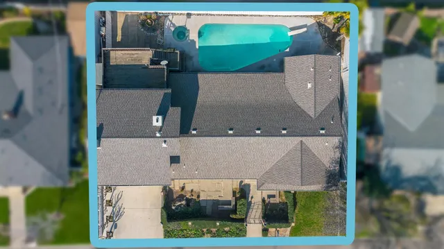 an aerial view of a house with swimming pool