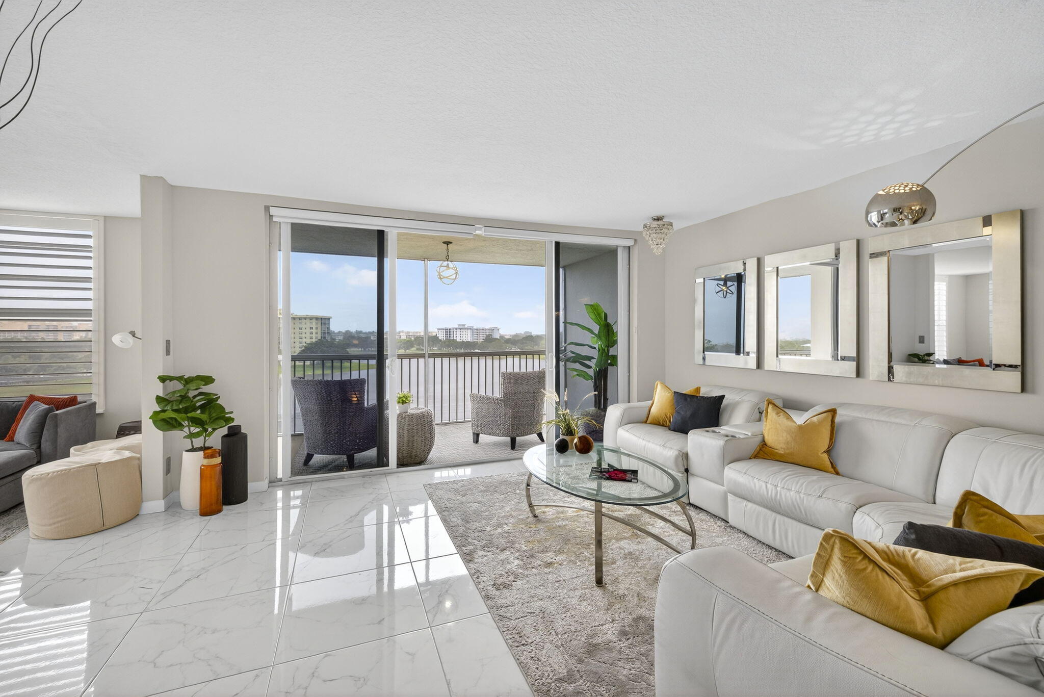 3091 North Course Drive, Unit 710 Pompano Beach, FL 33069 - Photo 11 of 46 a living room with furniture and a potted plant