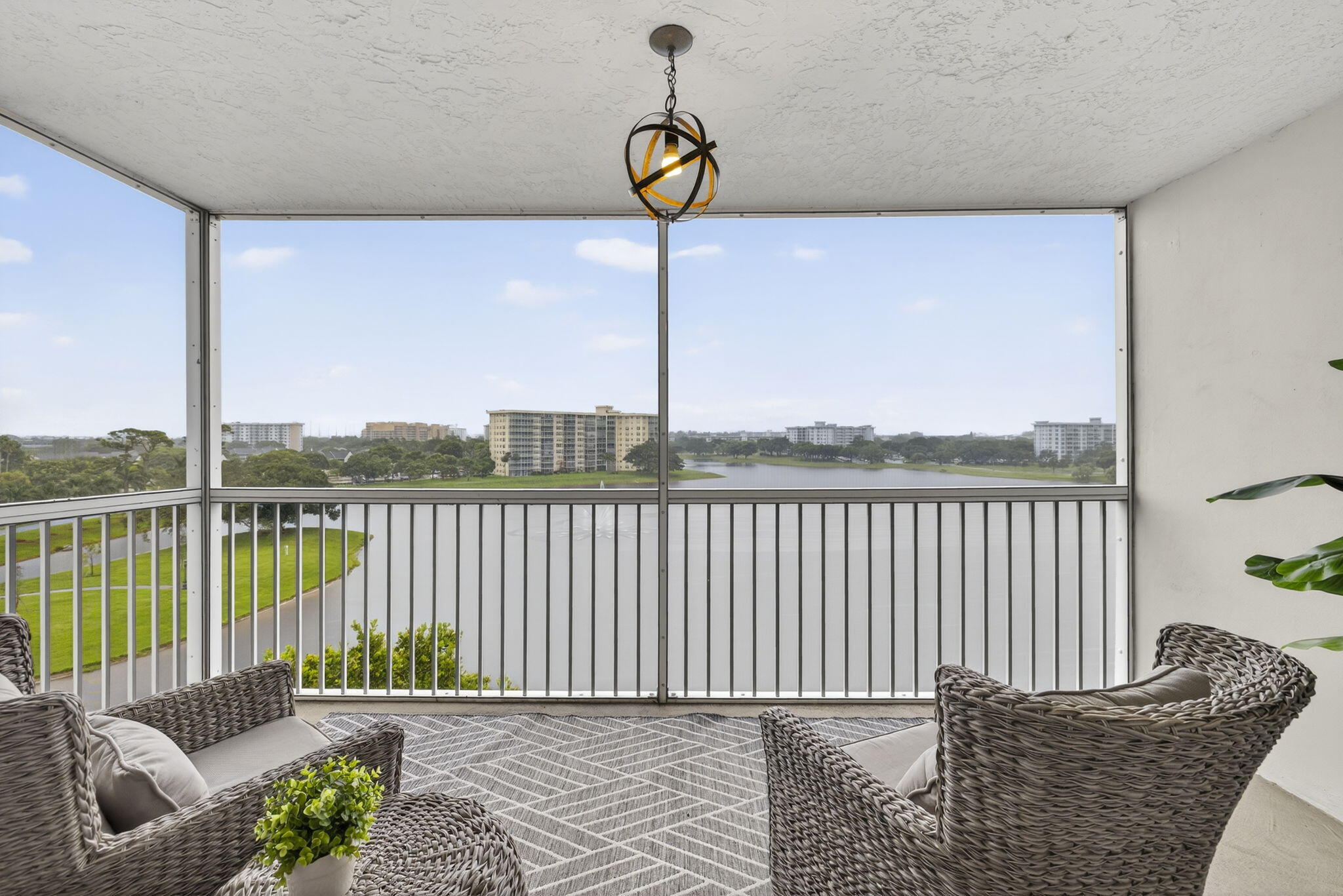 3091 North Course Drive, Unit 710 Pompano Beach, FL 33069 - Photo 15 of 46 a balcony with a couch
