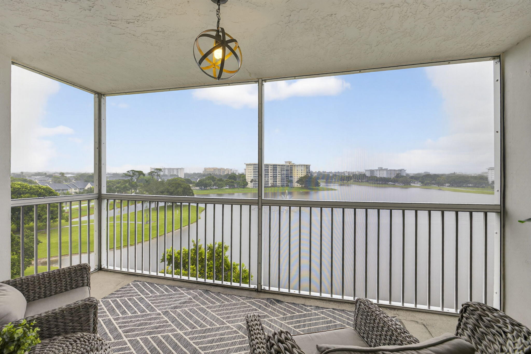 3091 North Course Drive, Unit 710 Pompano Beach, FL 33069 - Photo 16 of 46 a view of balcony with couch