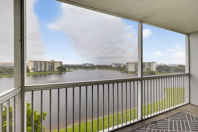 a view of a balcony with lake from a balcony