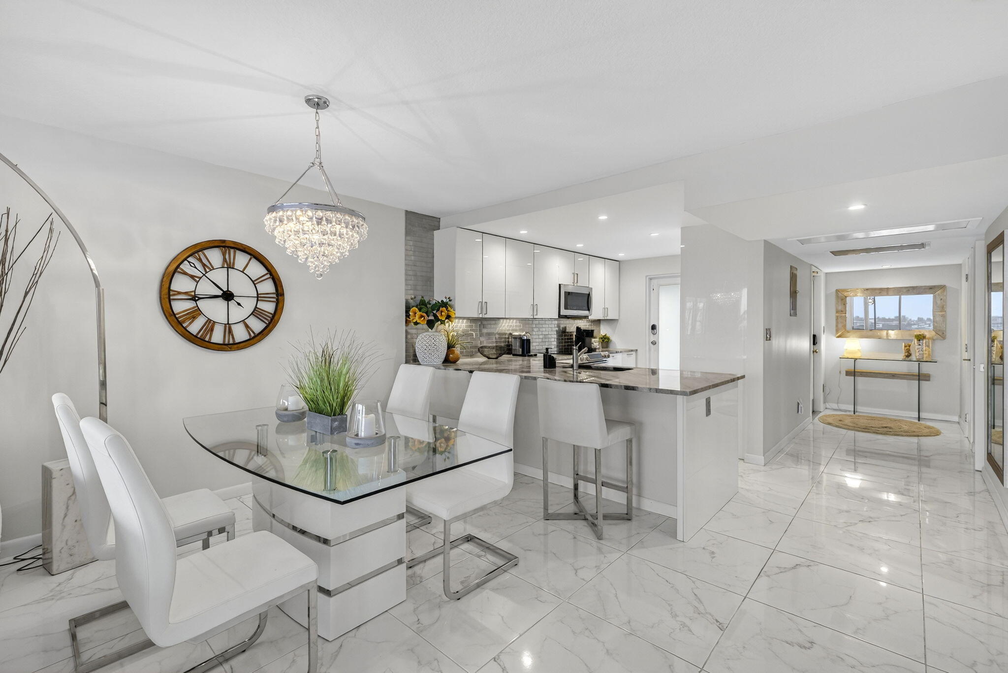 3091 North Course Drive, Unit 710 Pompano Beach, FL 33069 - Photo 18 of 46 a view of kitchen with kitchen island dining table and stainless steel appliances