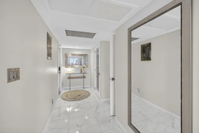 a view of a hallway with wooden shelves