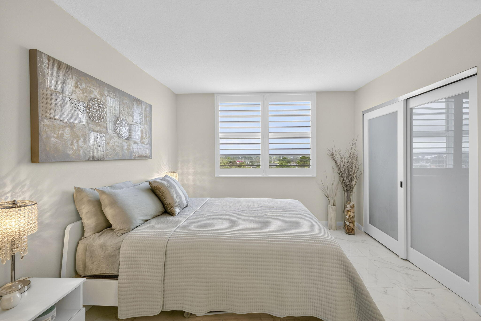 3091 North Course Drive, Unit 710 Pompano Beach, FL 33069 - Photo 21 of 46 a bedroom with a bed and a window