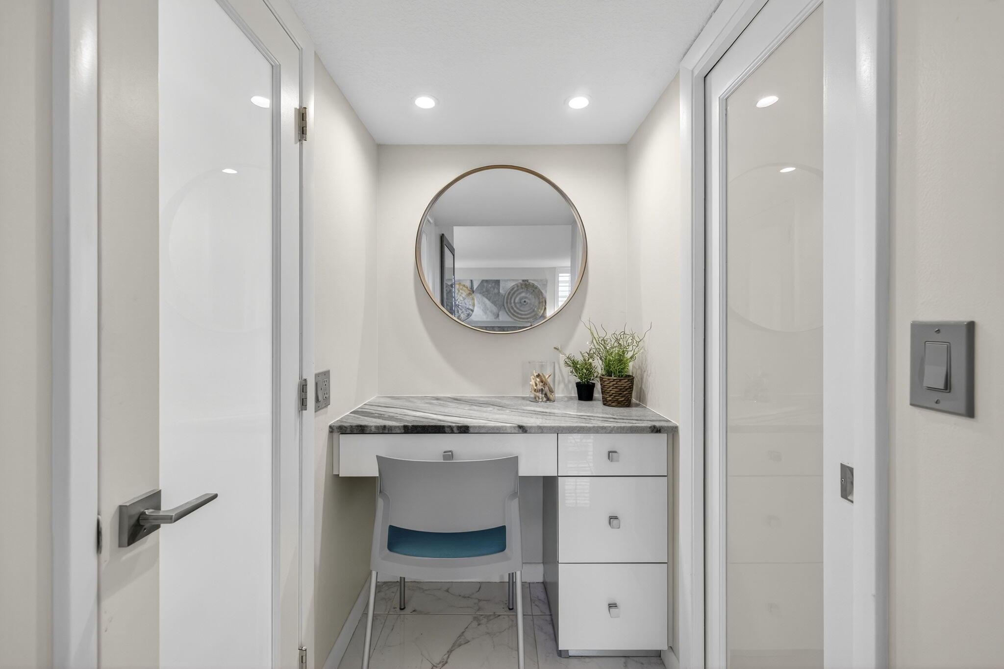 3091 North Course Drive, Unit 710 Pompano Beach, FL 33069 - Photo 29 of 46 a view of a hallway with a table and chairs