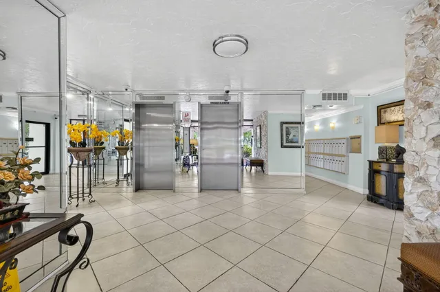 a view of a lake with a large building in the background