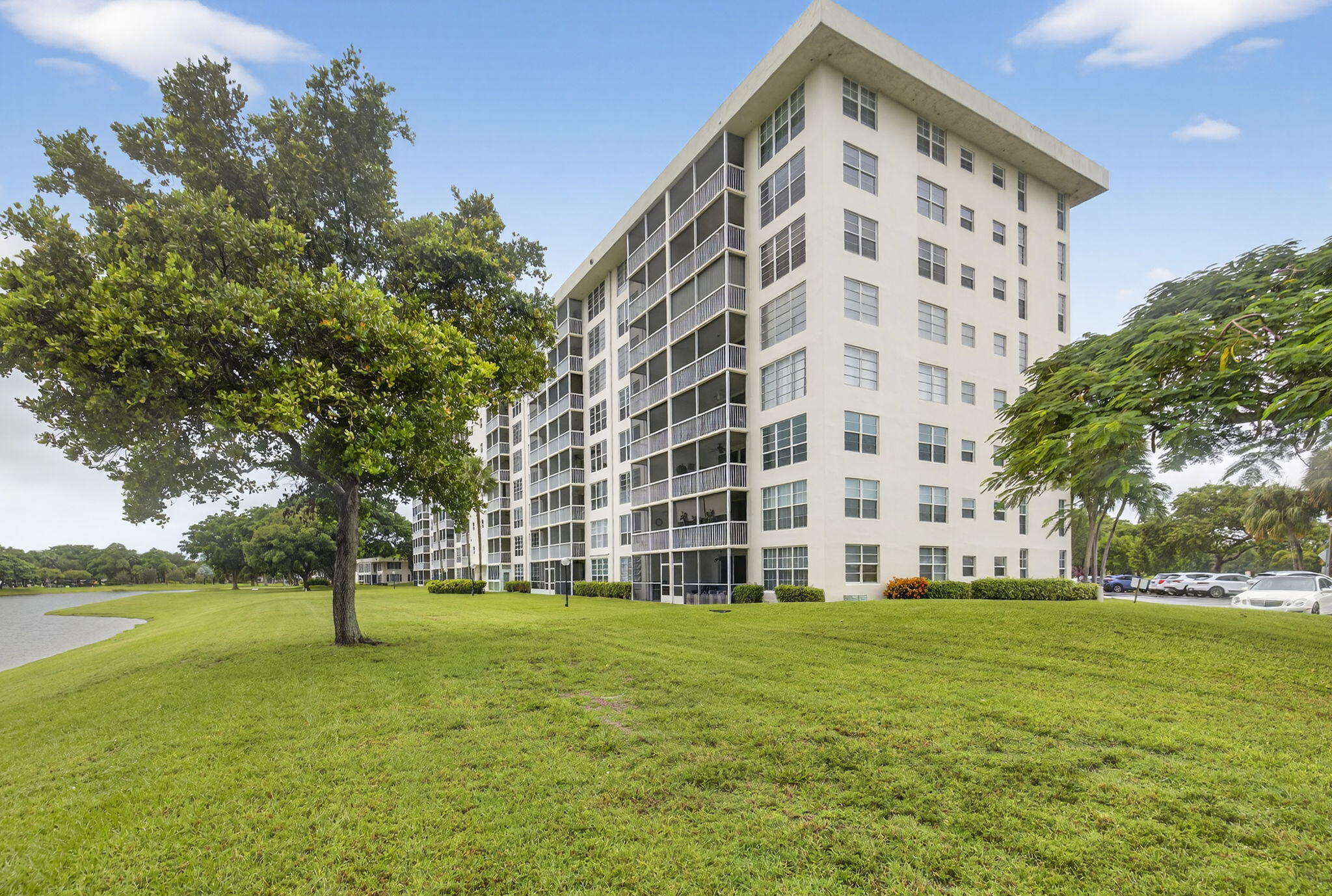 3091 North Course Drive, Unit 710 Pompano Beach, FL 33069 - Photo 41 of 46 a view of building with yard