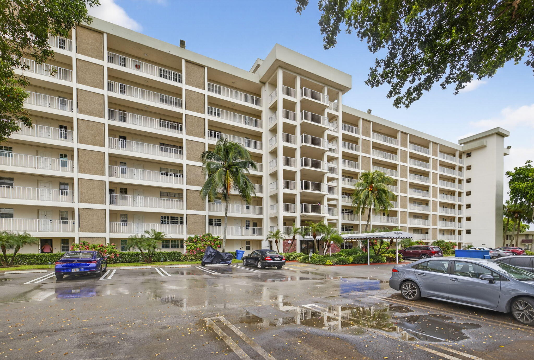 3091 North Course Drive, Unit 710 Pompano Beach, FL 33069 - Photo 42 of 46 a front view of a building with street view