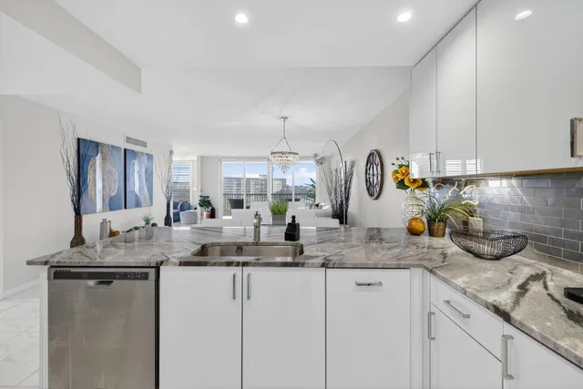a kitchen with sink a counter and cabinets