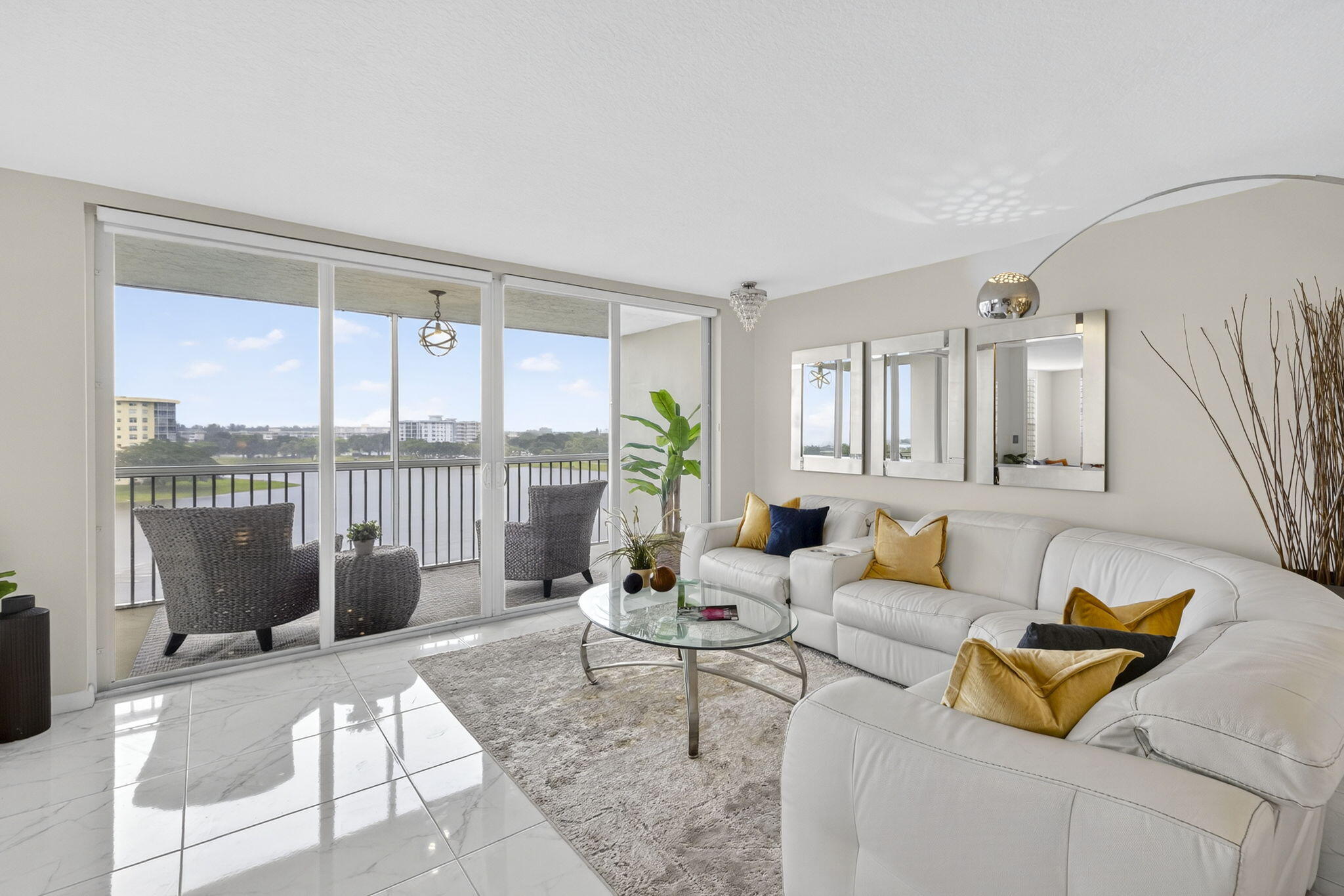 3091 North Course Drive, Unit 710 Pompano Beach, FL 33069 - Photo 10 of 46 a living room with furniture and a table