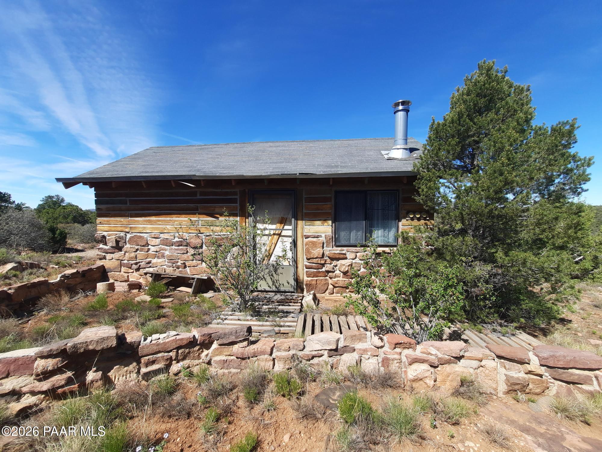 30109002 B Off Retirement Road Seligman, AZ 86337 - Photo 6 of 12 a backyard of a house with table and chairs
