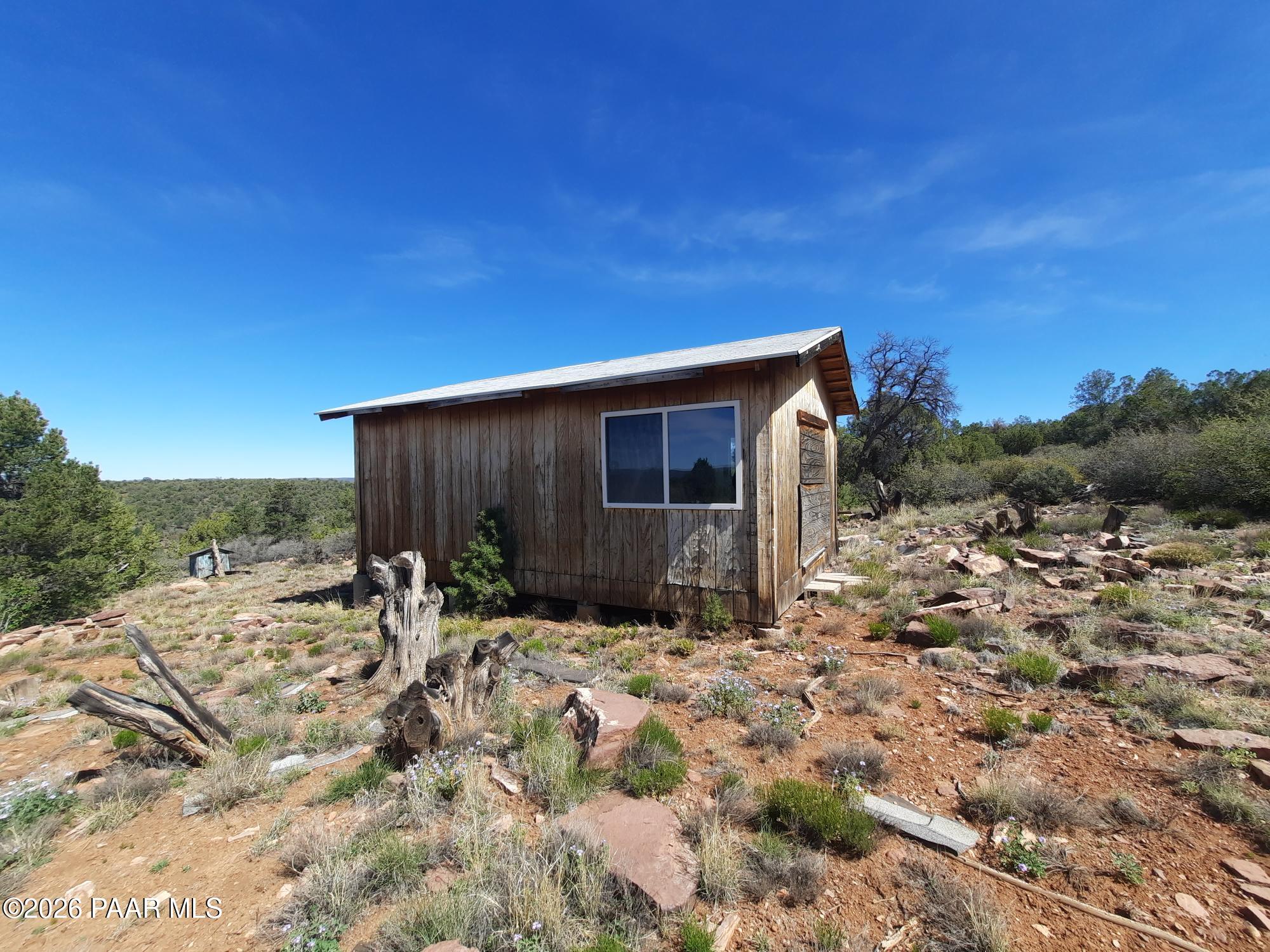 30109002 B Off Retirement Road Seligman, AZ 86337 - Photo 8 of 12 a backyard of a house with table and chairs