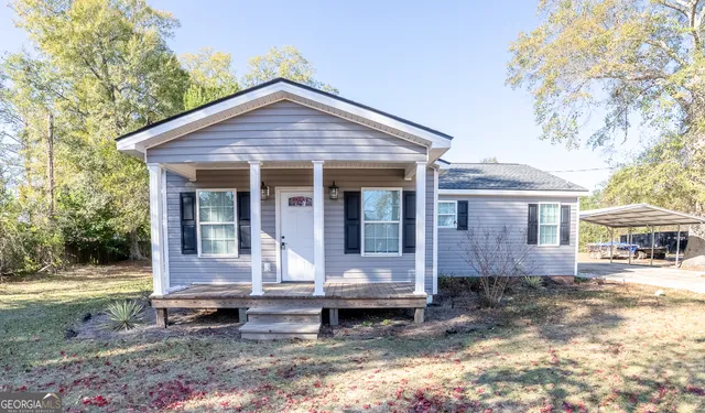 a front view of a house with garden