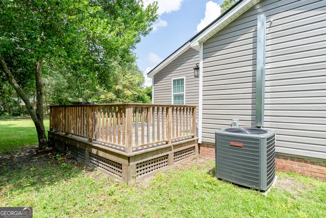 a view of a backyard with sitting area