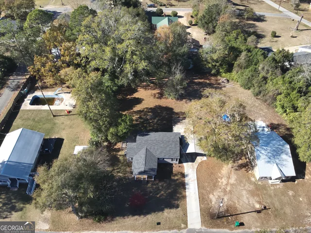an aerial view of house with yard