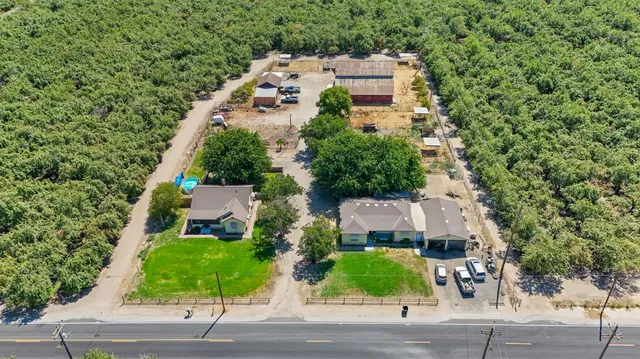 an aerial view of a house with a garden space