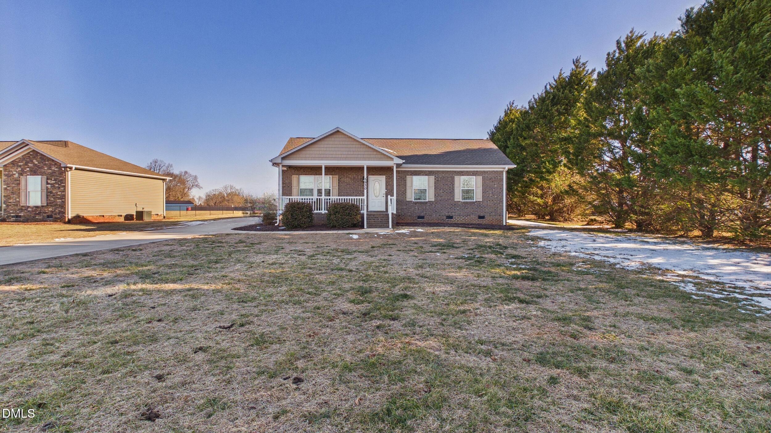 5930 Old 421 Road Liberty, NC 27298 - Photo 1 of 42 a front view of a house with a yard