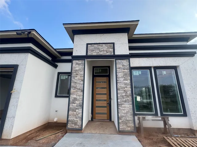 a front view of a house with glass door
