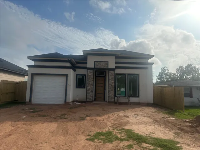 a view of a house with a garage