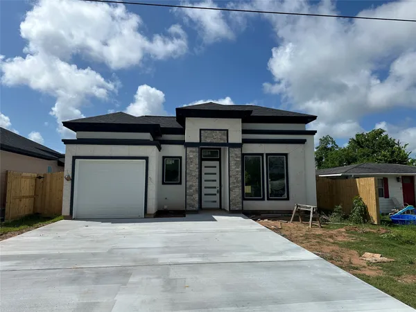 a front view of a house with a garage