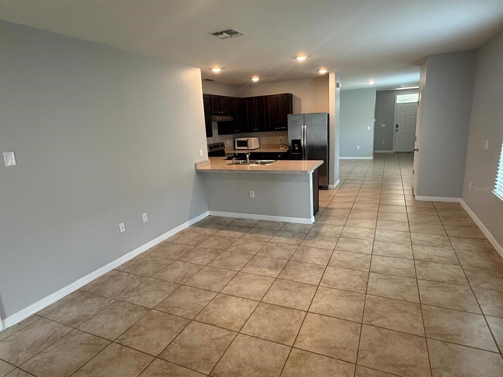 754 Chinoy Road Davenport, FL 33837 - Photo 16 of 26 a view of a kitchen with a sink