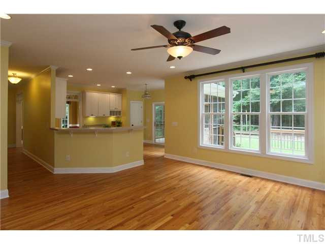 6909 Pinnacle Ridge Road Raleigh, NC 27603 - Photo 14 of 25 Family room has beautiful hardwood floors. Den/Family/Great Room