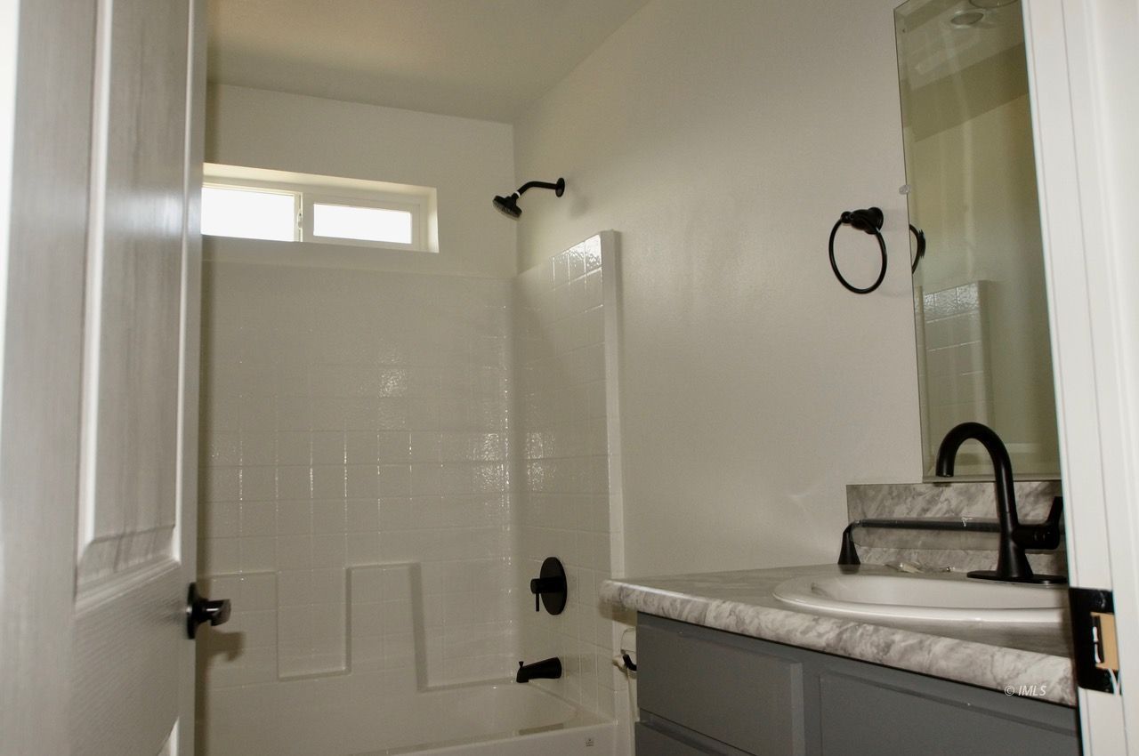 161 Tuolumne Road Bishop, CA 93514 - Photo 16 of 23 a bathroom with a sink and mirror