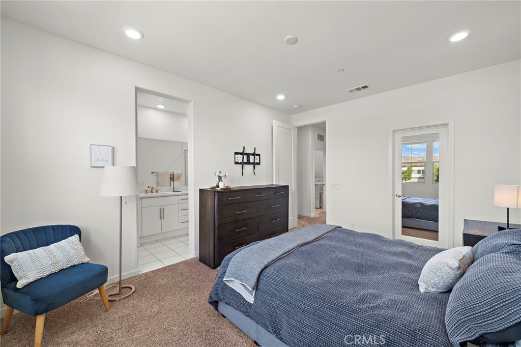 144 Paramount Irvine, CA 92618 - Photo 15 of 43 a bedroom with a bed and furniture